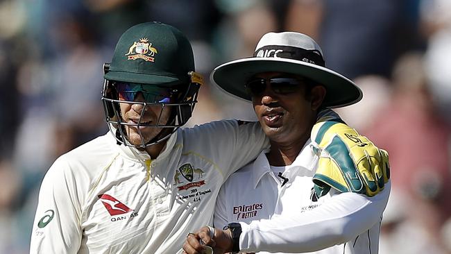 Tim Paine, here with Umpire Kumar Dharmasena, said he might need to take a level three umpires course. Picture: Ryan Pierse/Getty Images