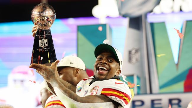 Jerick McKinnon of the Kansas City Chiefs celebrates with the the Vince Lombardi Trophy after defeating the Philadelphia Eagles 38-35 in Super Bowl LVII. (Photo by Christian Petersen/Getty Images)