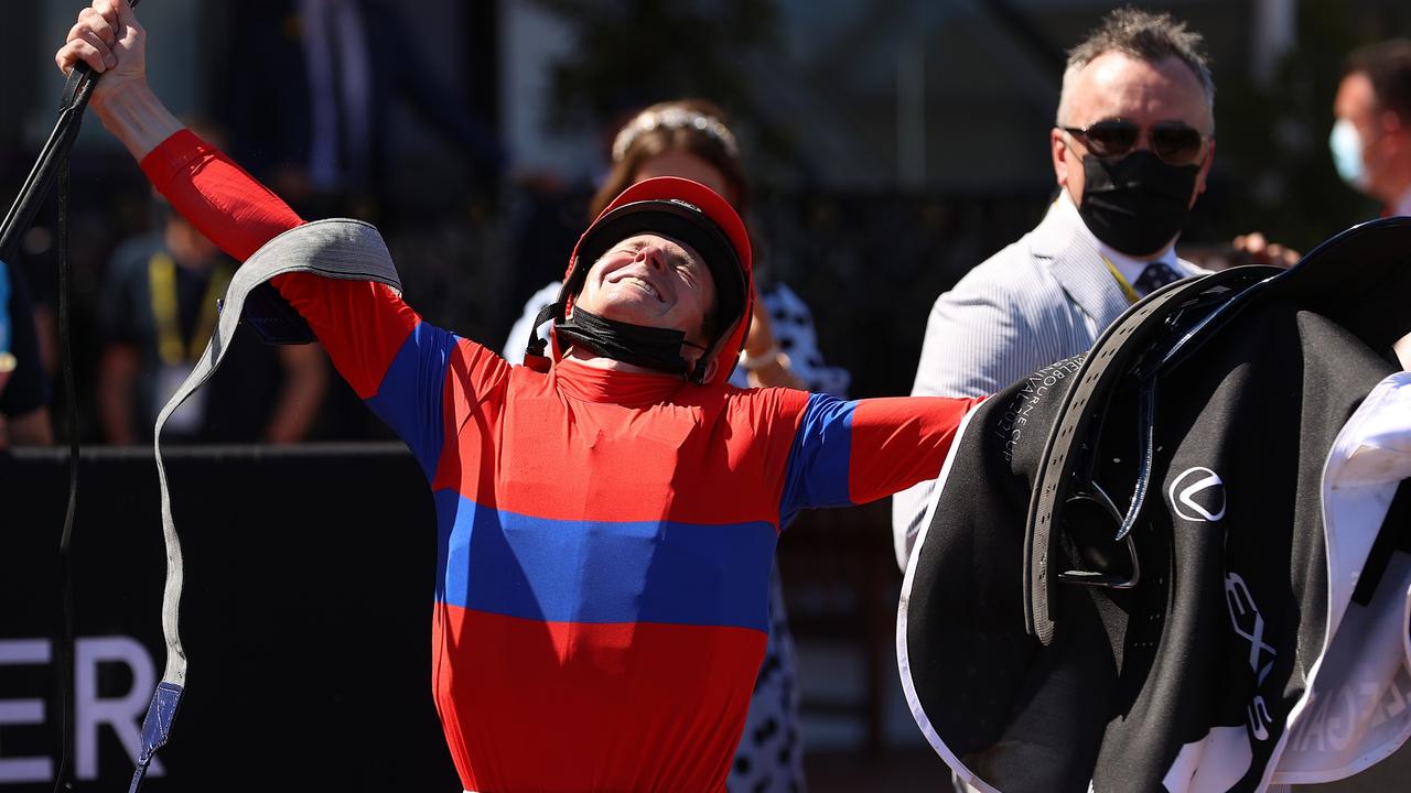 MELBOURNE, AUSTRALIA - NOVEMBER 02: James Mcdonald riding #4 Verry Elleegant celebrates after winning race 7, the Lexus Melbourne Cup during 2021 Melbourne Cup Day at Flemington Racecourse on November 02, 2021 in Melbourne, Australia. (Photo by Robert Cianflone/Getty Images)