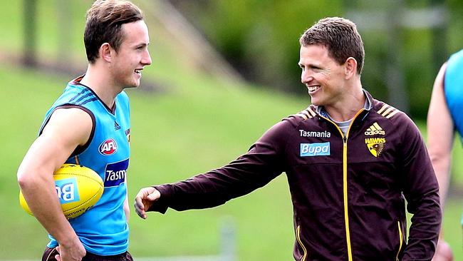 Young gun Billy Hartung talks to interim coach Brendan Bolton at training. Picture: Wayne Ludbey