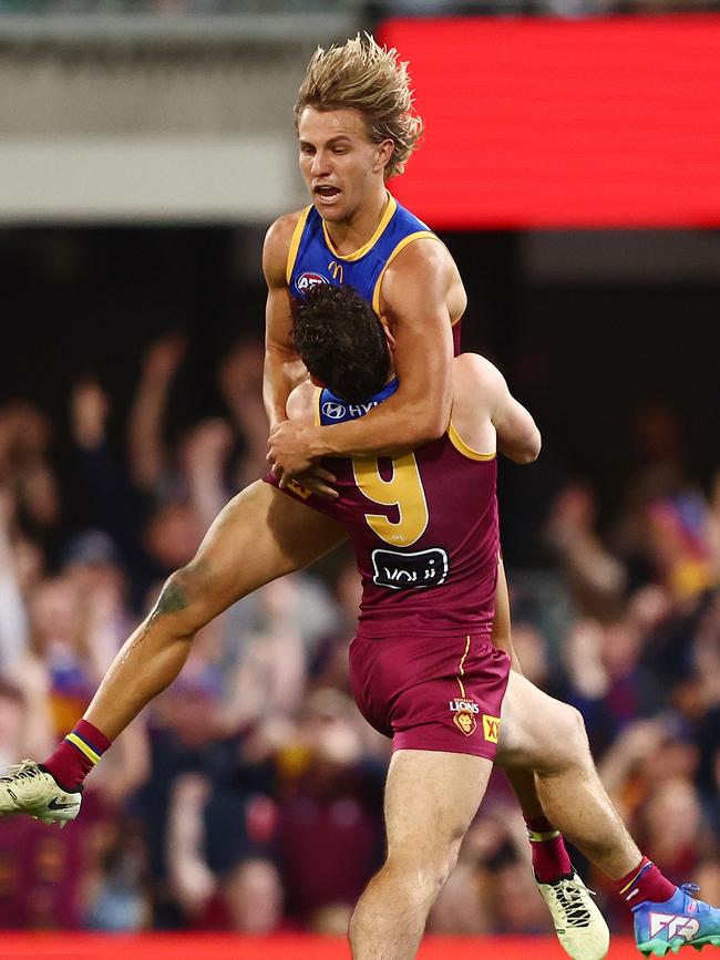 Lohmann leaps into the arms of Lachie Neale. Picture: Chris Hyde/Getty Images