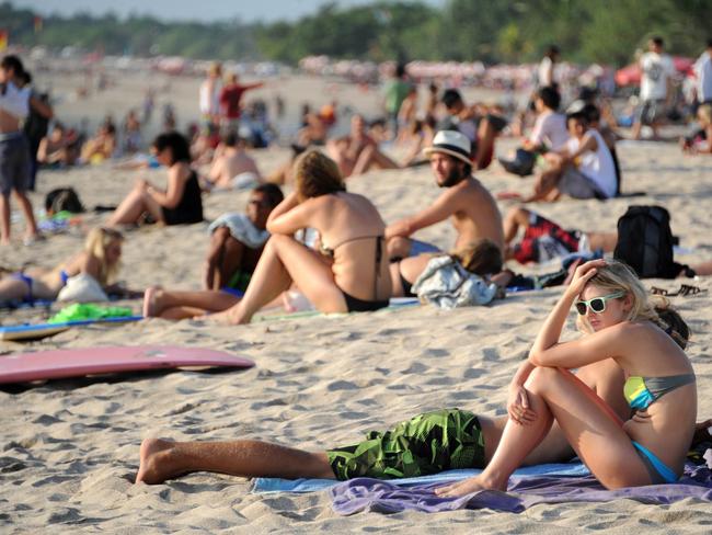 Tens of thousands of tourists, from Australia and elsewhere visit Kuta beach every year. Picture: AFP PHOTO / Sonny TUMBELAKA