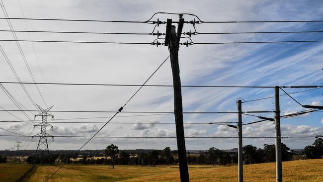 Electricty poles snake through a rural property on Sydney’s fringes. Picture: Brendan Esposito