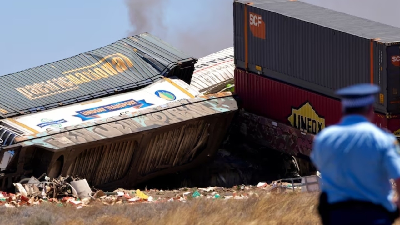 The train caught fire and several carriages derailed in the crash. Picture: ABC News/Bill Ormonde