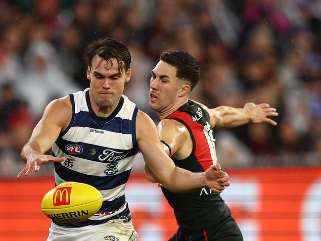 Jack Bowes kicks under pressure from Jade Gresham. Picture: Graham Denholm/Getty Images