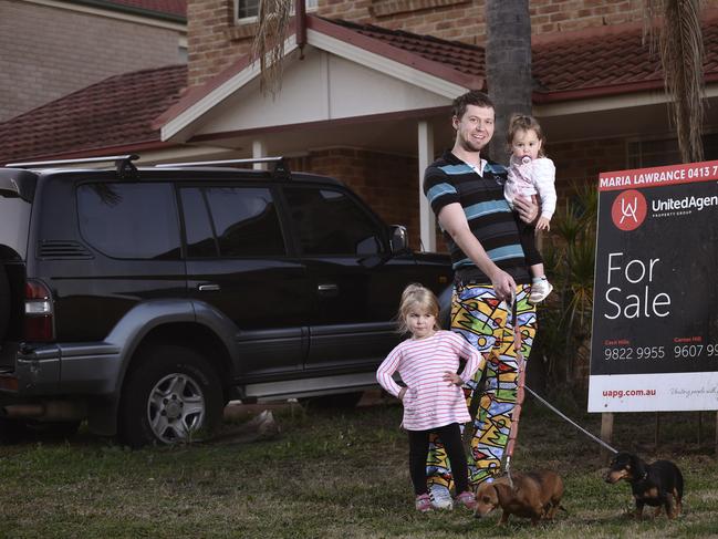 Kyle Sinclair and his 2 daughters  Zara 1 year old (Held in his arms) and Amelia 4 years old standing, photographed at  13A Wesley Place, Horningsea Park. . Thursday , 2 August  2018.Kyle Sinclair and his family are about to start looking for their next home Kyle: 0421545021(The Daily Thelegraph / Flavio Brancaleone)