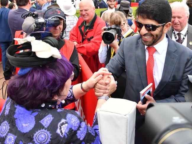 Part-owner Debbie Kepitis is congratulated by trainer Saeed bin Suroor after the race.