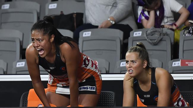 Giants players Kristina Manu'a with Matisse Letherbarrow on the bench in Super Netball.