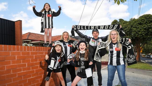 WEEKEND : AFL clubs and suburbs with members. Linda Monteneri with her son Matthew 19yrs and Lauren 25yrs and other supporters Lucinda 8yrs , Pia 10yrs and Milli 11yrs in the suburb of Reservoir. Picture: Ian Currie