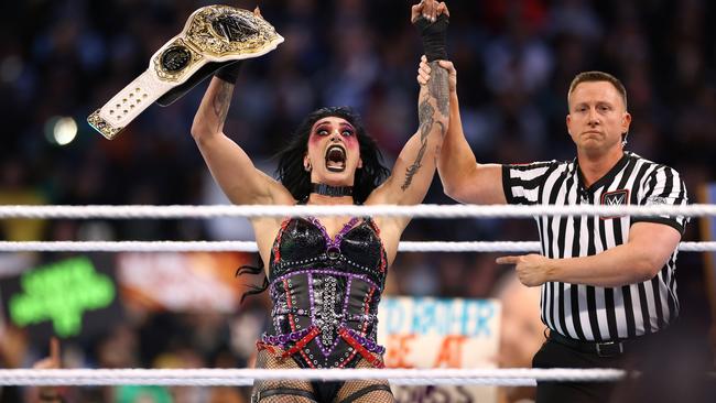 Rhea Ripley reacts after winning the WWE Women's World Championship at WrestleMania 40. (Photo by Tim Nwachukwu/Getty Images)