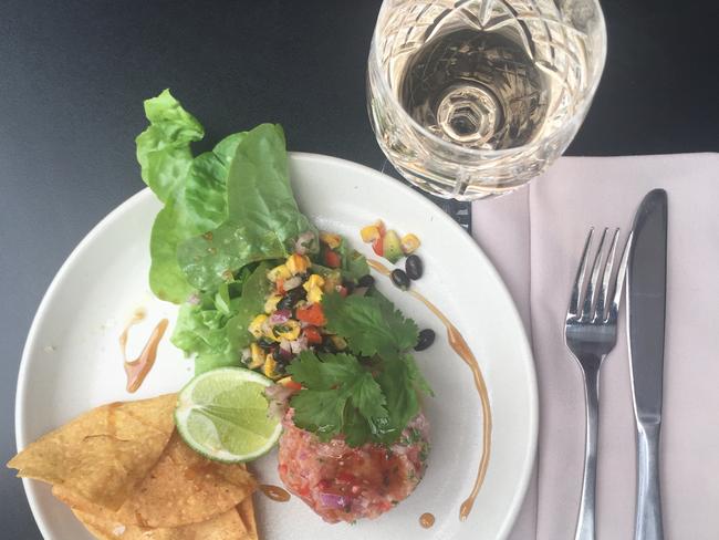 Salmon ceviche with onion, lime and corn chips at El Patio De Cuba restaurant in Chevron Renaissance Shopping