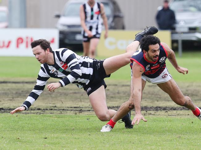 North Geelong's Charlie Farrell (left), in his first game since 2023, tangles with Anakie's Jake Long. Picture: Alan Barber