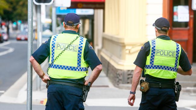 Tasmania Police officers patrol Launceston’s CBD streets enforcing social distancing restrictions. Picture: PATRICK GEE