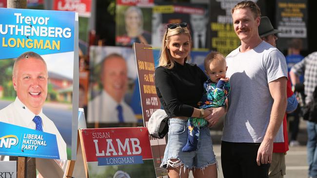 Judy and Chris Perry with baby chase after lodging their votes. Picture: Lyndon Mechielsen