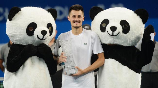 Bernard Tomic celebrates his title at the ATP Chengdu Open.