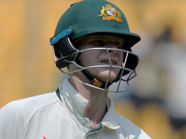 Australian captain Steve Smith walks back to the pavilion after his dismissal for 28 runs during the fourth day of the second Test match between India and Australia at The M. Chinnaswamy Stadium in Bangalore on March 7, 2017. / AFP PHOTO / Manjunath KIRAN / ----IMAGE RESTRICTED TO EDITORIAL USE - STRICTLY NO COMMERCIAL USE----- / GETTYOUT