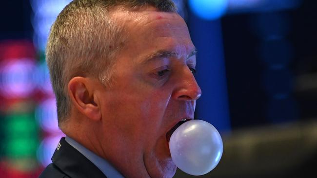 A trader chews gum as he works on the floor of the New York Stock Exchange. Picture: AFP