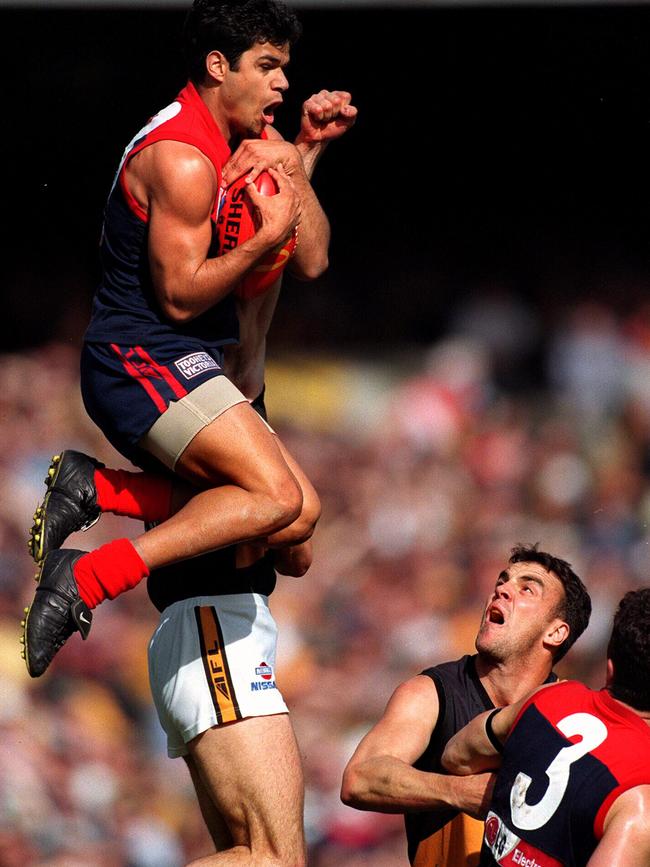 Jeff Farmer launches off Garry Lyon’s back.