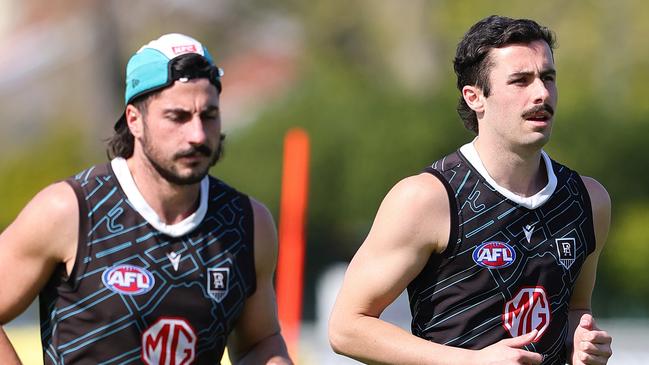 ADELAIDE, AUSTRALIA - SEPTEMBER 12: Lachie Jones, Josh Sinn and Jase Burgoyne during a Port Adelaide Power captain's run at Alberton Oval on September 12, 2024 in Adelaide, Australia. (Photo by Sarah Reed/Getty Images)