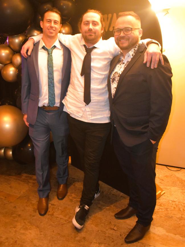 Sam Scammell, Aaron Amory and John Burt having a great night at the Cowwarr Saints Football &amp; Netball Club Golden Gala Ball 2024. Picture: Jack Colantuono