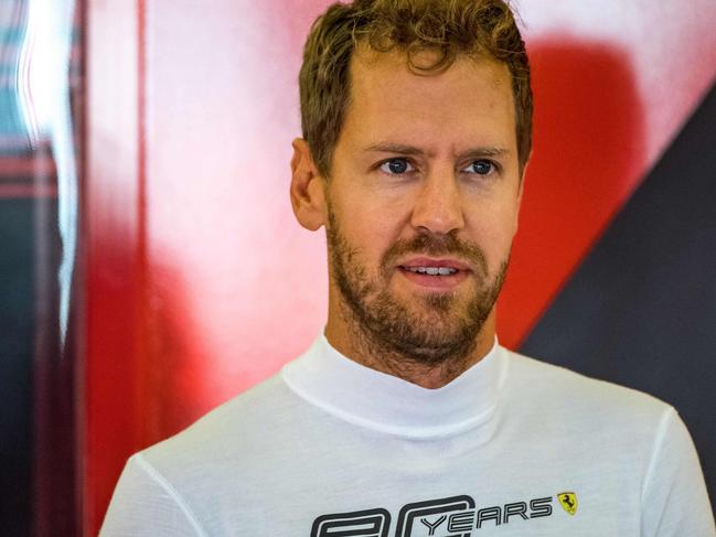 Ferrari's German driver Sebastian Vettel prepares to drive during first practice at Silverstone motor racing circuit in Silverstone, central England, on July 12, 2019 ahead of the British Formula One Grand Prix. (Photo by ANDREJ ISAKOVIC / AFP)