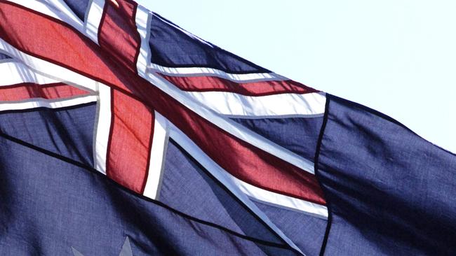 Aboriginal flag and Australian Flag fluttering in the wind.