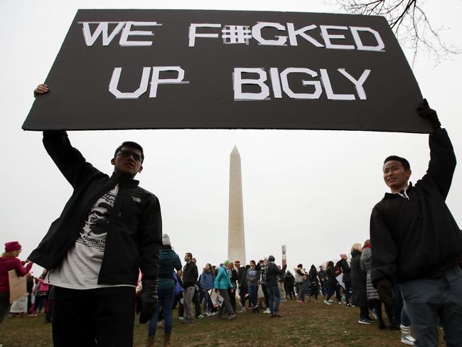 Protesters hold up a sign near the Washington Monument during the Women's March on Washington. Picture: Drew Angerer/Getty Images