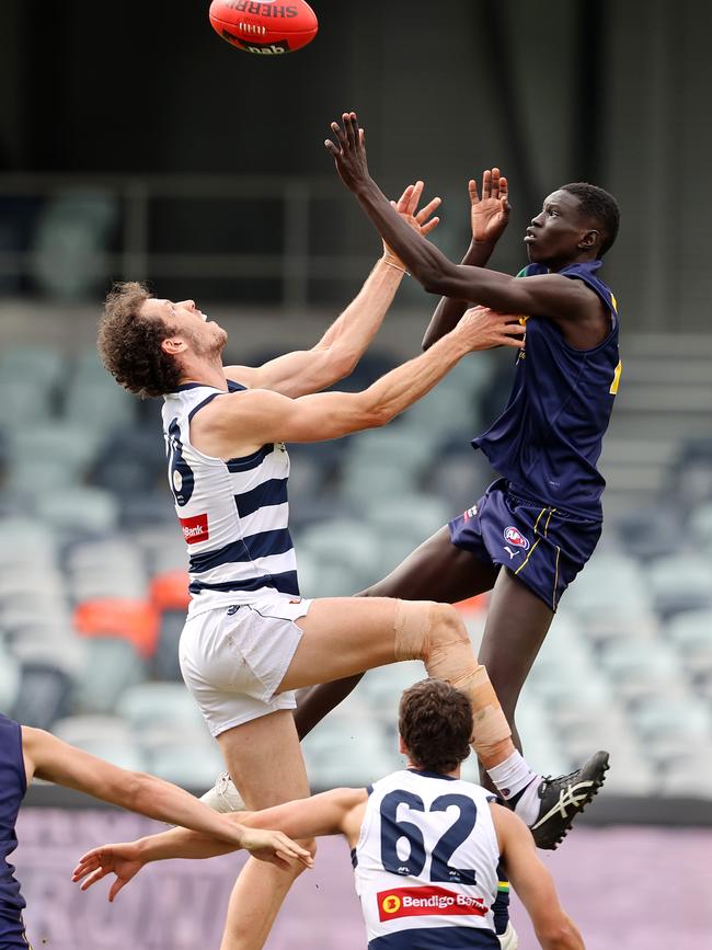 Darcy Fort comes up against Mac Andrew in the ruck. Pic: Michael Klein