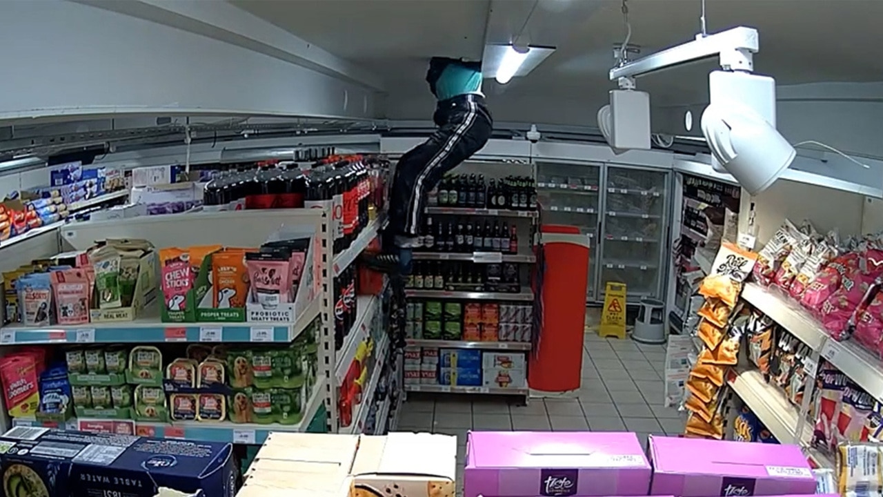 Thief in UK caught on camera climbing through supermarket roof