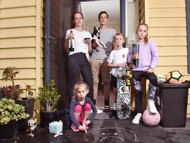 The fed-up Lund family Alana and Ben and kids Grace, 10, Jack,8, and Willa, 5, with dog Fly. Picture: Nicki Connolly