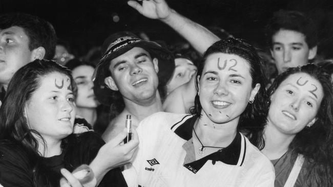 Music fans with 'U2' written on their faces in lipstick at the Irish band's Adelaide concert at Football Park in 1993.