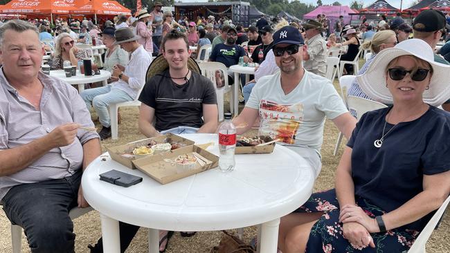 Camperdown's Paul Coverdale, Taylor Neal, Paul Hewitt and Kellie Coverdale tuck into some tasty food at Meatstock 2023 at the Melbourne Showgrounds.