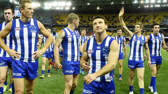(from left) Drew Petrie, Brent Harvey, Nick Dal Santo and Michael Firrito thank North Melbourne fans.