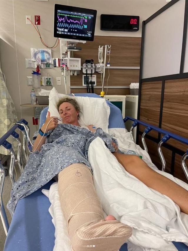 Golfer Sarah Kemp puts on a brave face while in hospital.