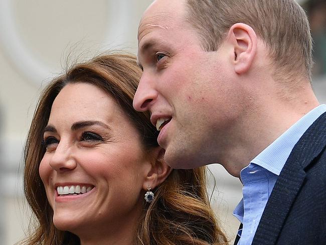 Britain's Catherine, Duchess of Cambridge (L) and Britain's Prince William, Duke of Cambridge react as they look towards the Cutty Sark, as they arrive to launch the King's Cup Regatta, at the Cutty Sark in Greenwich, south east London on May 7, 2019. - The event is set to take place on August 9, 2019, on the Isle of Wight, and is set to see The Duke and Duchess go head to head as skippers of individual sailing boats, in an eight boat regatta race. Each boat taking part will represent one of eight charities and the winning team will be awarded the historic trophy The King's Cup. (Photo by Ben STANSALL / various sources / AFP)