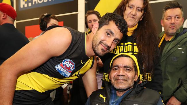 Marlion Pickett and his parents after the 2019 AFL Grand Final.