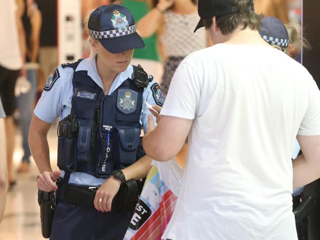 Pacific Fair retailers are bracing themselves for another huge Boxing Day Sales period. Police inspecting bags.