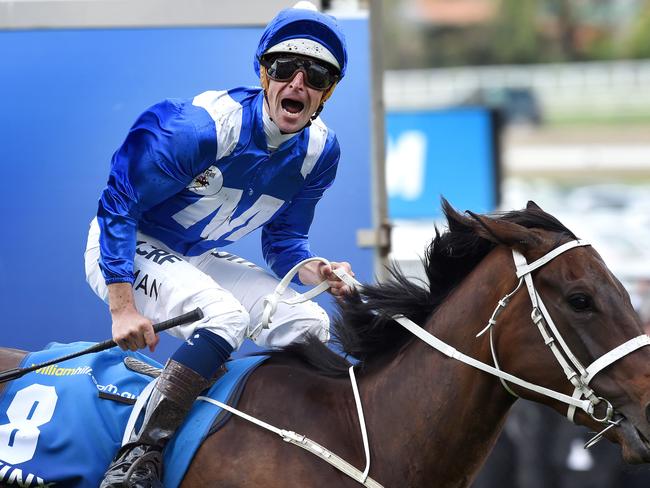 An emotional Hugh Bowman celebrates as Winx crosses the finish line. Picture: Nicole Garmston