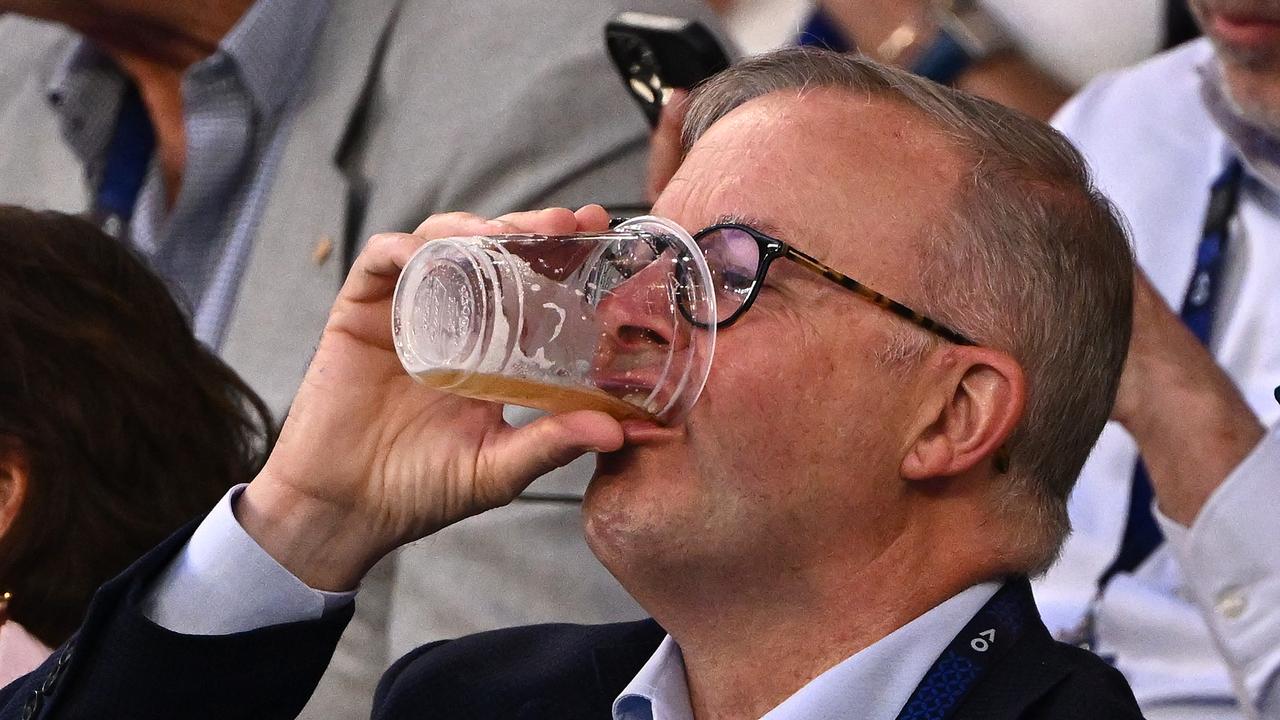 Prime Minister Anthony Albanese emjoys a beer at the tennis last night. Picture: Quinn Rooney/Getty Images