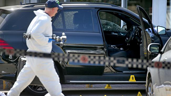 Forensic police tag the crime scene. Picture: Toby Zerna