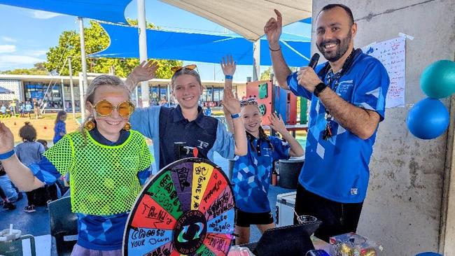 Students Isla, Sienna and Viola couldn’t believe it when teacher, George Mamouzellos, hit the mic during Larrakeyah Primary School’s Business Enterprise Marketing Day on Thursday.