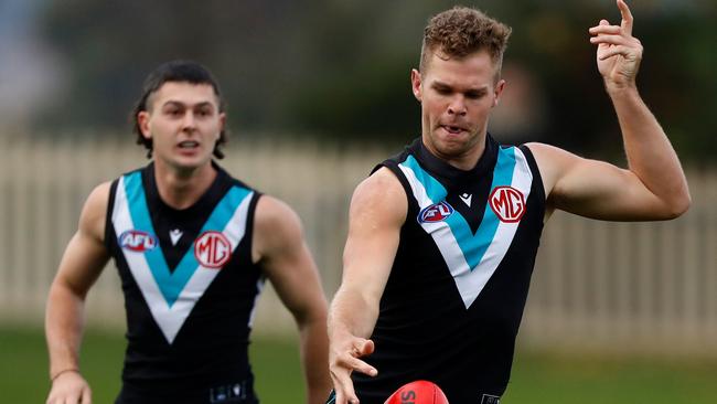 Dan Houston launches Port Adelaide forward.