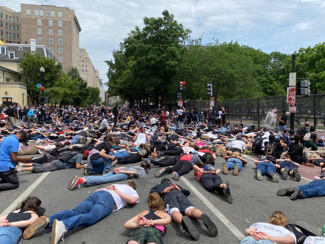 Protesters lie down in front of Lafayette Square (R) and St. John's Episcopal Church (L), in Washington, DC. Picture: AFP