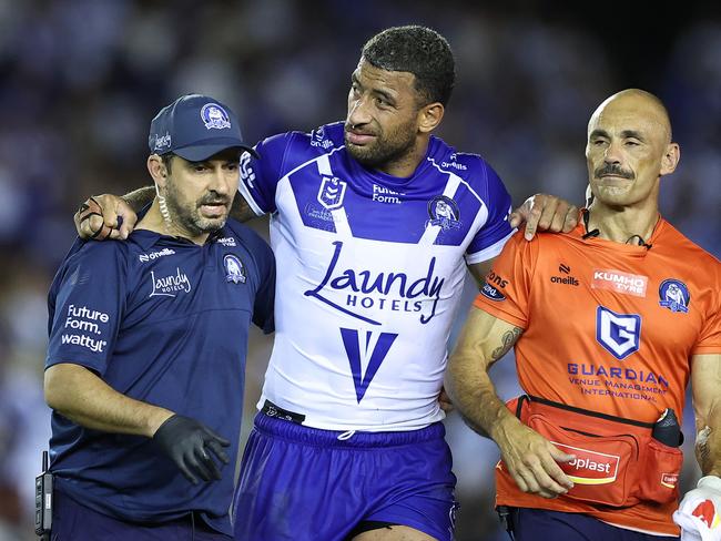 Viliame Kikau comes from the field with a knee injury. Picture: Jeremy Ng/Getty Images