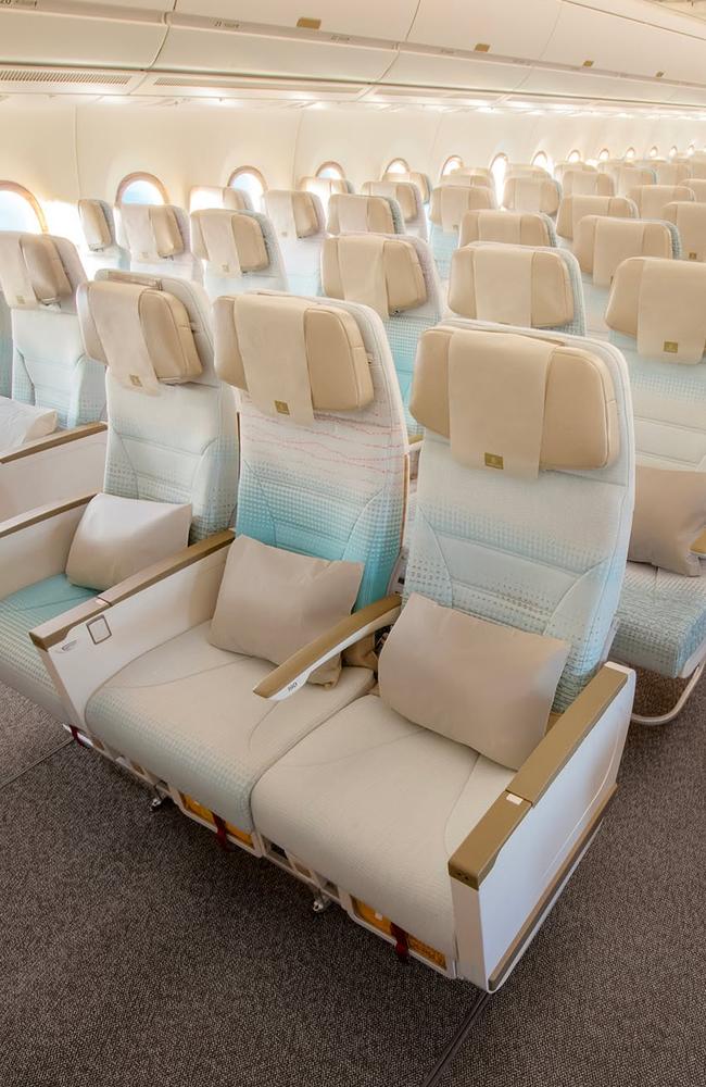 The economy seat has a new fabric in an ‘uplifting and elegant light blue, with luxurious bronze-coloured armrests’. Picture: Emirates