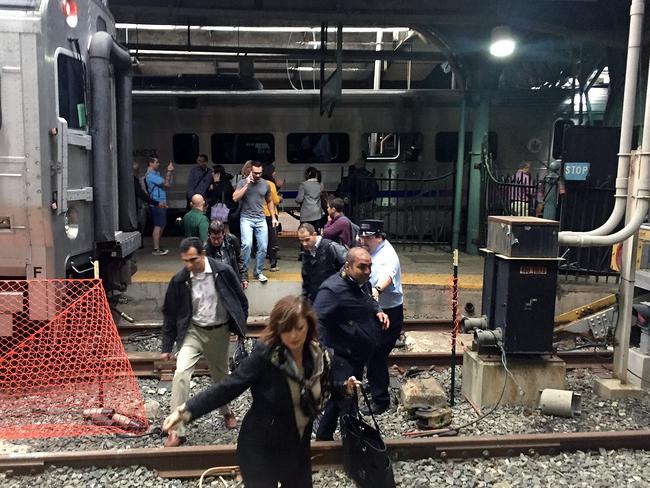 Passengers rush to safety after a NJ Transit train crashed into the platform at the Hoboken Terminal. Picture: Pancho Bernasconi/Getty Images/AFP