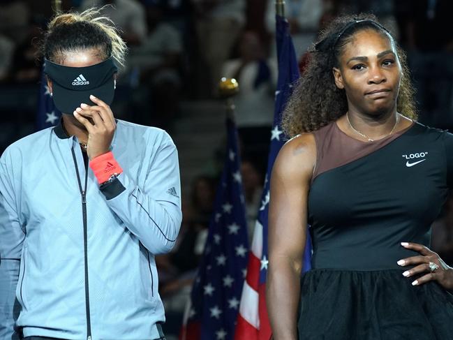 Winner Naomi Osaka and Williams in the aftermath of the heated final. Picture: Timothy Clary/AFP