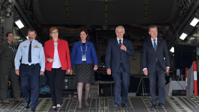 Australian Prime Minister Malcolm Turnbull (second right), with Minister for Defence, Senator Marise Payne (second left), Member for Corangamite Sarah Henderson (centre), Minister for Defence Industry Christopher Pyne and Chief of Air Force Air Marshal Leo Davies (left) at the back of a C-17 Globemaster III at Avalon, Melbourne. Picture Tracey Nearmy.