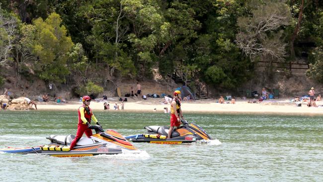 Lifesavers watch over tourists and locals enjoying Tallebudgera Creek. Picture: Mike Batterham