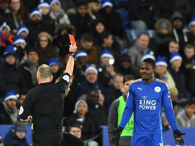 Daniel Amartey of Leicester City is shown the red card by referee Jonathan Moss